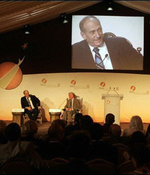 Israeli Prime Minister Ehud Olmert (L) talks during a session with Elie Wiesel at the Second Petra Conference of Nobel Laureates, in the ancient city of Petra, Jordan (AFP)
