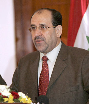 Iraqi Prime Minister Nuri al-Maliki gestures during a news conference in Baghdad, 14 June, 2006 (REUTERS)