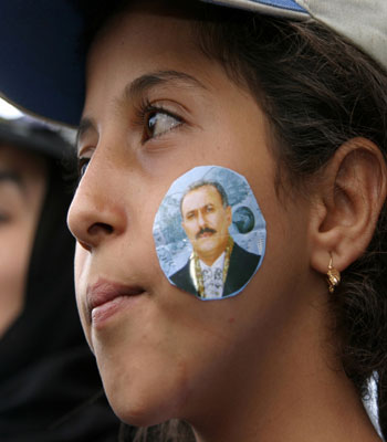 A girl attends a rally to support Yemeni President Ali Abdullah Saleh in Sanna (R)