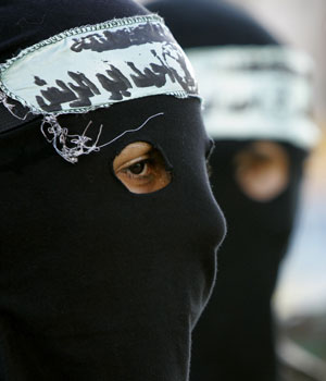 Palestinian Al Aqsa Martyrs Brigades militants participate in a demonstration calling for the release of prisoners jailed in Israel in Gaza City, Monday, June 26, 2006 (AP)