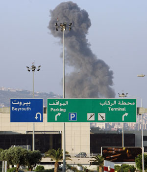 Smoke billows from the Rafik Hariri International Airport in Beirut following Israeli air strikes, 13 July 2006 (AFP)