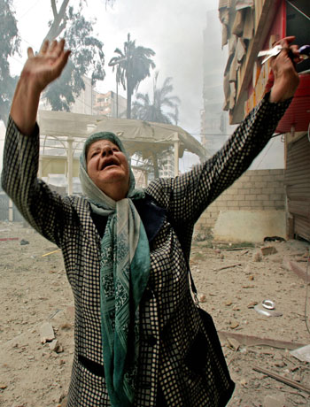 An elderly Lebanese woman reacts after surveying her destroyed apartment (AP)