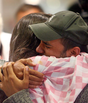 Relatives welcome the refugees arriving on a special flight from Lebanon at the airport Dusseldorf, Germany, 18 July 2006 (EPA)