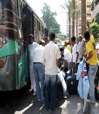 Saudi citizens board a bus from the Saudi embassy in Beirut, Lebanon (EPA)