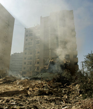 A picture taken 22 July 2006 shows destroyed buildings in one of Beirut's southern neighborhoods, a Hezbollah stronghold, following Israeli air raids (AFP)