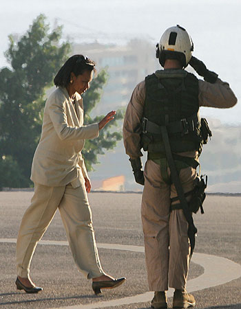 US Secretary of State Condoleezza Rice salutes a US Marine as she walks towards a helicopter upon her departure from Beirut (AFP)