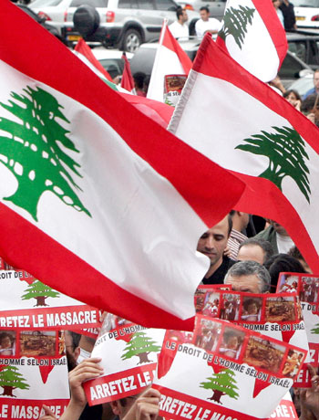 People demonstrate to denounce the Israeli attacks in Lebanon,in Paris (R)