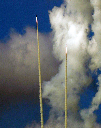 Hezbollah missiles streak the sky as they are launched towards Israel from the southern Lebanese port city of Tyre (AFP)