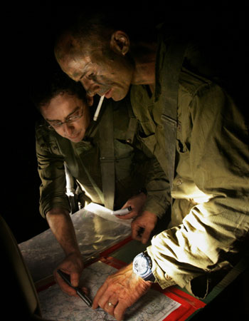 Israeli soldiers examine a map, before entering Lebanon from northern Israel(AFP)