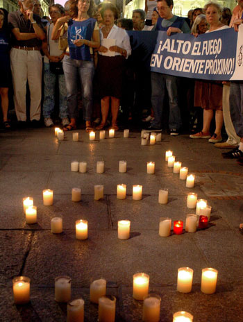 Citizens of Madrid participate in a candle vigil in support of Lebanon and against Israel called by Amnesty International (EPA)