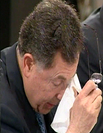 Video grab of Lebanon's PM Siniora pausing during his speech to dab his eyes at a meeting of Arab foreign ministers in Beirut (R)