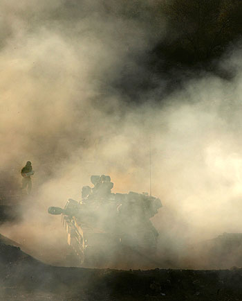 An Israeli artillery unit fires shells across the border towards southern Lebanon from northern Israel (AP)