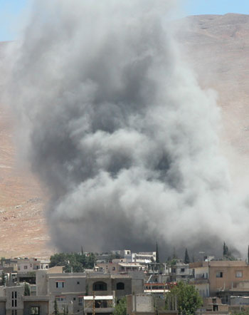 Smoke rises after an Israeli air strike on Baalbeck (R)
