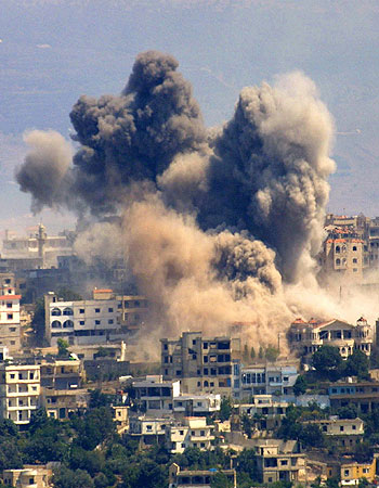 Smoke rises from Khiam village during Israeli air strikes in south Lebanon (R)