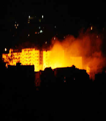An Israeli air strike hits near apartment blocks in a Hezbollah strong hold in the southern suburbs of Beirut, Lebanon, late Sunday (AP)