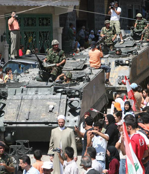 Villagers celebrate as Lebanese soldiers arrive at Shebaa village in south Lebanon, August 18, 2006 (REUTERS)