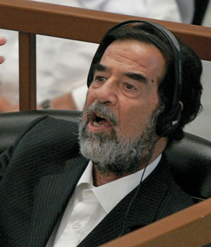 Former Iraqi leader Saddam Hussein addresses the court on the second day of his trial, for genocide against Kurds in the 1980s, in Baghdad August 22, 2006 (REUTERS)