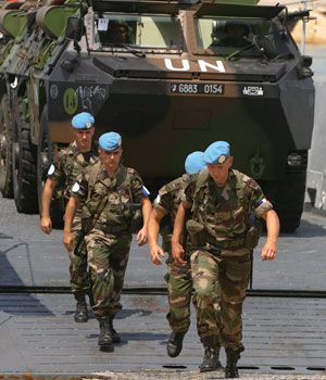 French troops disembark in the southern Lebanese port of Naqura, 25 August 2006 (AFP)