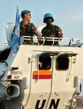 French U.N. peacekeepers sit atop their armored personnel carrier in the southern town of Marjayoun, Lebanon (AP)