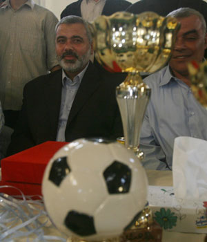 Palestinian Prime Minister Ismail Haniya attends a football match in Gaza City,13 September 2006. Haniya, who will be charged with forming a new national unity government, said  he saw no point to resuming stalled negotiations with Israel (AFP)