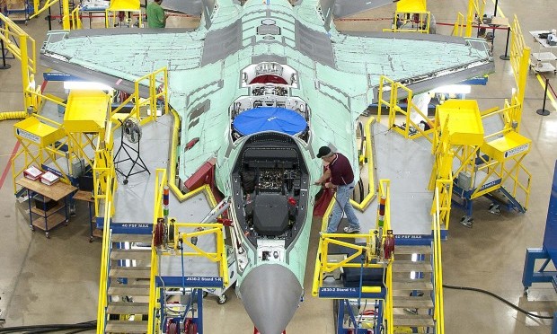 Workers can be seen on the moving line and forward fuselage assembly areas for the F-35 Joint Strike Fighter at Lockheed Martin Corp's factory located in Fort Worth, Texas in this October 13, 2011 handout photo provided by Lockheed Martin. (REUTERS/Lockheed Martin/Randy A. Crites/Handout)