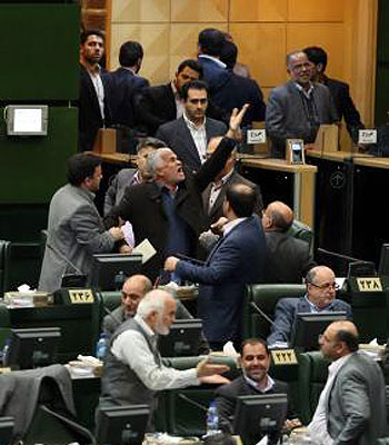 An Iranian Member of Parliament (MP) objects as President Mahmoud Ahmadinejad delivers a speech to the parliament in Tehran on February 3, 2013.(AFP)