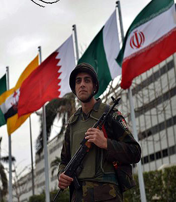Egyptian presidential guard stand outside a hotel in Cairo .during the 12th summit of the Organization of Islamic Cooperation (OIC). (AFP)
