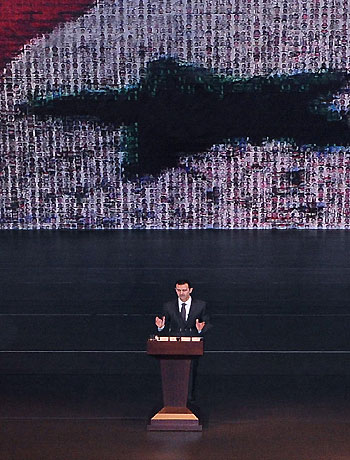 A handout picture released by the official Syrian Arab News Agency (SANA) shows Syria's embattled President Bashar al-Assad making a public address on January 6, 2013 at the opera house in Damascus. (AFP)