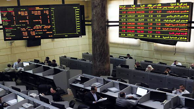Traders work at the Egyptian stock exchange in Cairo. (R)