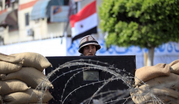 Egyptian soldiers stand guard outside the prison in Port Said, Egypt, Saturday, March 9, 2013.  (AP Photo/Khalil Hamra)