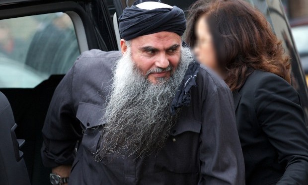In this file picture taken on November 13, 2012 terror suspect Abu Qatada arrives at his home in northwest London , after he was released from prison. (AFP PHOTO / ANDREW COWIE)