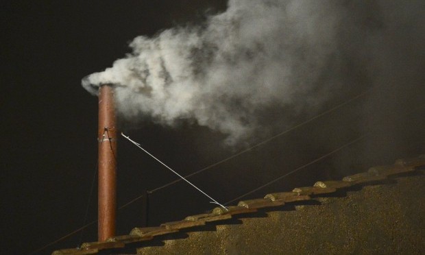 White smoke rises from the chimney on the Sistine Chapel indicating that a new pope has been elected at the Vatican, March 13, 2013. (REUTERS/Dylan Martinez)