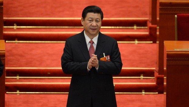 Chinese President Xi Jinping walks to his seat prior to the election for the new president of China during the 12th National People's Congress (NPC) in the Great Hall of the People in Beijing on March 14, 2013. Source: AFP PHOTO /GOH CHAI HIN