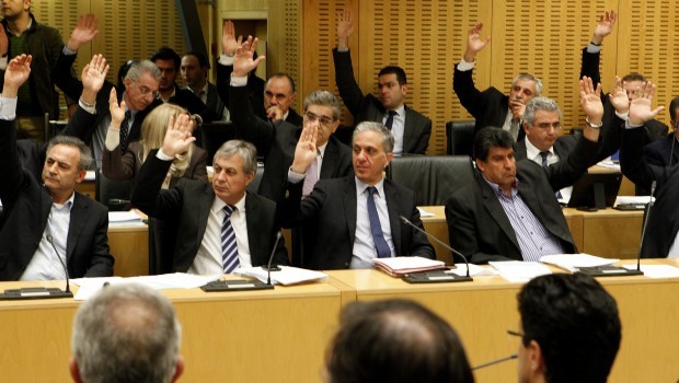 Cyprus lawmakers vote on key bills aimed at securing a broader bailout package from international creditors in parliament in capital Nicosia, Cyprus, late Friday, March 22, 2013. (AP Photo/Petros Karadjias)