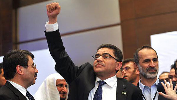 Ghasssan Hitto celebrates his election as Syria's provisional prime minister. (AFP)
