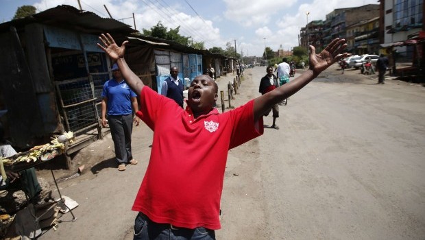 A supporter of Presidential candidate Uhuru Kenyatta celebrates in the Mathare slum in the Kenyan capital of Nairobi March 9, 2013. Source: REUTERS/Goran Tomasevic