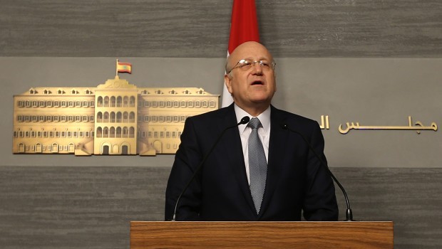 Lebanese Prime Minister Najib Mikati announces his resignation at the government palace, in Beirut, Lebanon, Friday, March 22, 2013. (AP Photo/Hussein Malla)