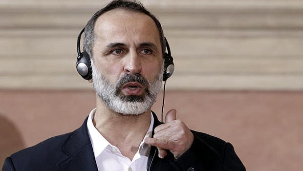 Syrian opposition coalition leader Moaz Alkhatib speaks during a press conference. (AP)
