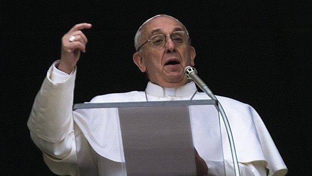 Pope Francis gestures as he delivers his Angelus prayer from the window of his studio overlooking St. Peter's Square. Source: AP Photo/Domenico Stinellis