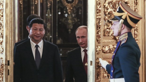 Russian President Vladimir Putin and his Chinese counterpart Xi Jinping meet at the Kremlin in Moscow. Source: REUTERS/Sergei Ilnitsky