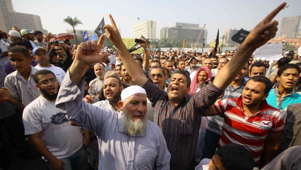 Egyptian Salafists shout slogans during a demonstration demanding the implementation of the Shari’a (Islamic law) in Cairo’s Tahrir Square on November 2, 2012. (AFP Photo)