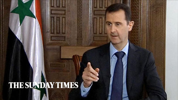 Syrian President Bashar Assad gestures while speaking during an interview with the Sunday Times, in Damascus, Syria. (AP)