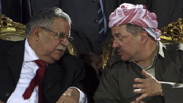 Massoud Barzani (R), president of the Kurdish regional government, and Iraq's President Jalal Talabani talk while attending a gathering of their supporters before the regional parliament election in Arbil, 310 km (190 miles) north of Baghdad, June 24, 2009. (REUTERS/Azad Lashkari)