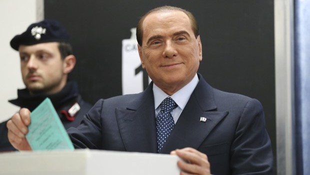 Former Premier Silvio Berlusconi casts his ballot in Milan, Italy, Sunday, Feb. 24, 2013. (AP Photo/Antonio Calanni)