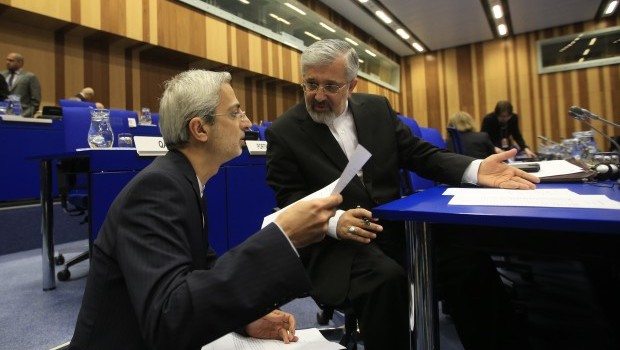 Iran’s envoy to the International Atomic Energy Agency (IAEA) Ali Asghar Soltanieh (R) discusses with a member of the Iranian delegation during the Board of Governors meeting at the UN atomic agency headquarters in Vienna, Austria on March 6, 2013. (ALEXANDER KLEIN/AFP/Getty Images) 