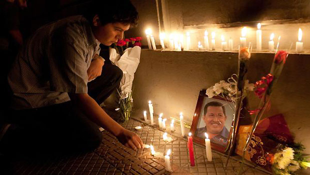Supporters of Venezuelan President Hugo Chavez light candles while gathering in front of the Venezuelan embassy in Santiago, Chile. (AFP)