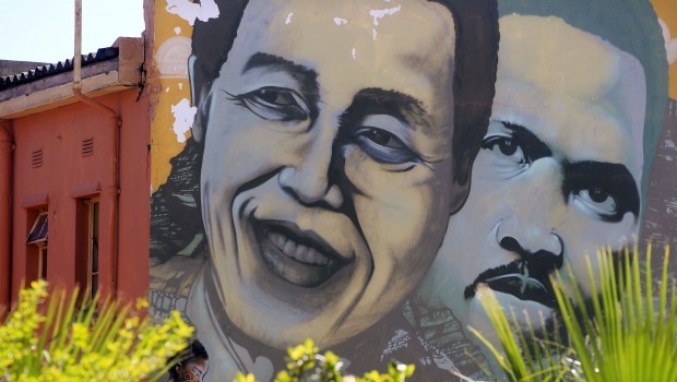 Nelson Mandela is pictured on a mural with South African apartheid freedom fighter Steve Biko, in the city of Cape Town, South Africa, March 10, 2013. Source: AP Photo/Schalk van Zuydam