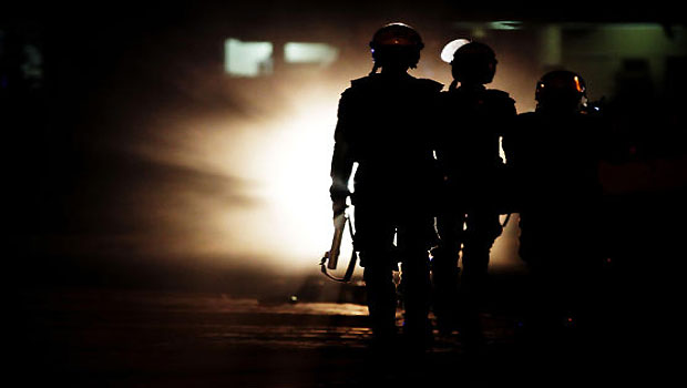 File photo shows riot police officers patrol during clashes with pro-democracy protestors following a march in Abu Saiba, Bahrain. (AP)