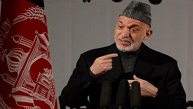 Afghan President Hamid Karzai speaks at a gathering of women to mark International Women's Day, in Kabul on March 10, 2013. (AFP)
