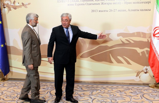 Kazakh Foreign Minister Yerlan Idrisov (R) shows the way to Iran’s top nuclear negotiator, Saeed Jalili, before the talks with world powers representatives on Iran’s nuclear program in the Kazakh city of Almaty on February 26, 2013. (STANISLAV FILIPPOV/AFP/Getty Images) 